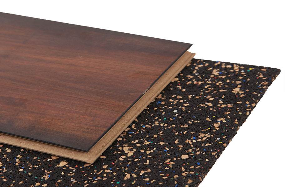 Acoustic Cork & Rubber Underlay – 3mm & 4.5mm – Premium Soundproofing, Eco-Friendly, Durable for All Flooring Types, shown with a wood-look plank on top of a dark, speckled rubber underlay.