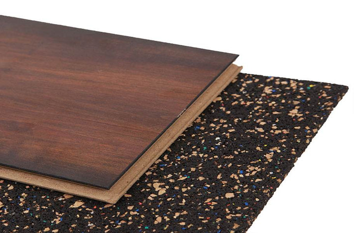 Acoustic Cork & Rubber Underlay – 3mm & 4.5mm – Premium Soundproofing, Eco-Friendly, Durable for All Flooring Types, shown with a wood-look plank on top of a dark, speckled rubber underlay.