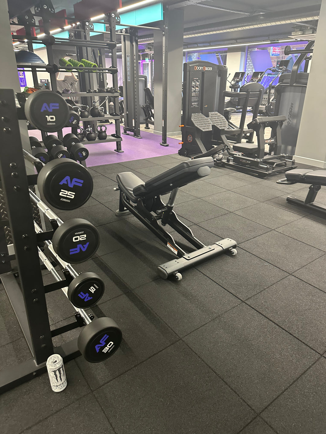 SilentTile 30mm Acoustic Gym Flooring Fitness Interlocking Tile featured in a modern gym setting, offering soundproof and noise reduction benefits with sturdy rubber-coated dumbbells and adjustable bench in the foreground.