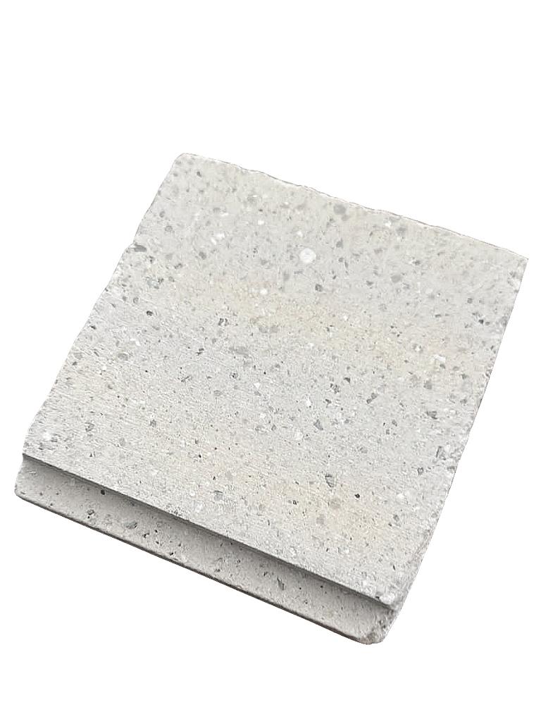 SilentScreed Cement Particle Board 22mm: A speckled grey engineered stone-like tile sample, showcasing acoustic soundproofing capabilities for optimal noise reduction and sound insulation, ideal for various applications.