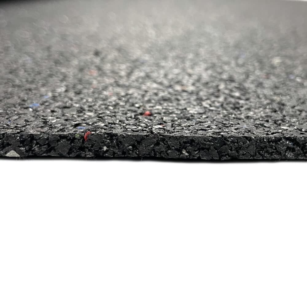 Edge view of recycled rubber acoustic soundproofing underlay sheet showing thickness and crumb texture