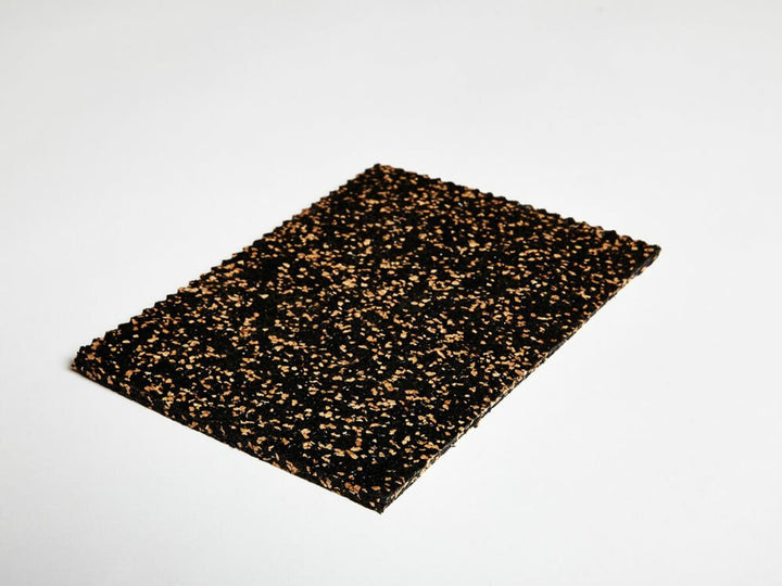 Acoustic Cork & Rubber Underlay – 3mm & 4.5mm – Premium Soundproofing, Eco-Friendly, Durable for All Flooring Types. Features speckled black rubber with brown-tan flecks for superior noise reduction and vibration damping.