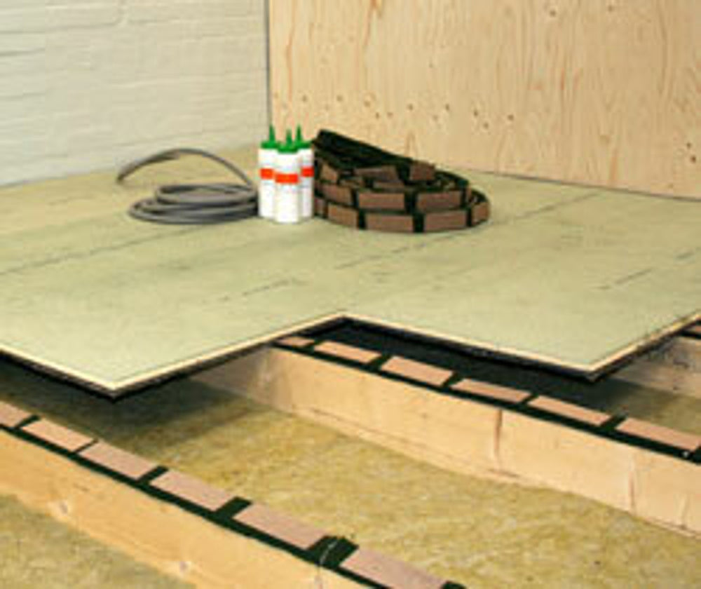 SilentCloud Felt 25 Acoustic Joist Strip illustration showing soundproof installation layers, including joists, mineral-wool insulation, resilient strips, and sub-floor, for noise reduction and sound insulation in construction projects.