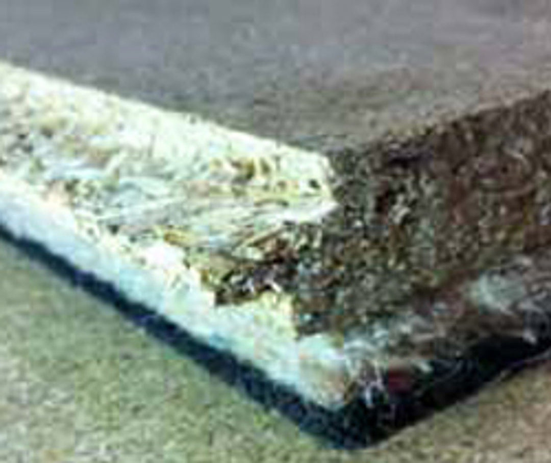 SilentCloud Panel 33 - High Performing Acoustic Floorboards, showcasing a layered structure with a fibrous top, dense padding, and dark backing, ideal for soundproofing and noise reduction in construction applications.