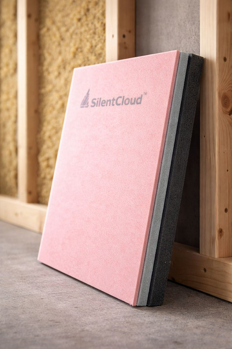 30mm Direct-to-Wall Soundproofing Panel | High-Mass Wall Sound Insulation (Part E Ready), exhibiting SilentCloud branding against a wooden stud wall, showcases layered foam design for acoustic noise reduction and vibration damping.